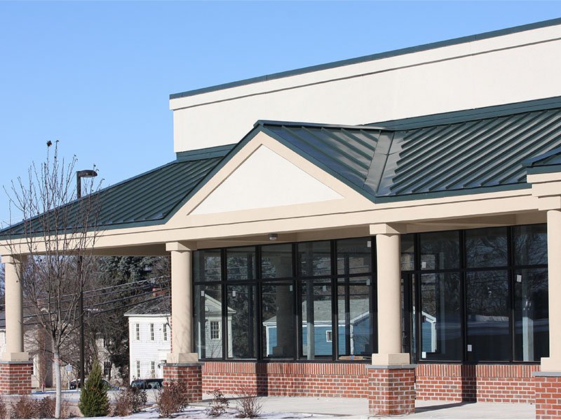 Metal roof on brick and concrete business